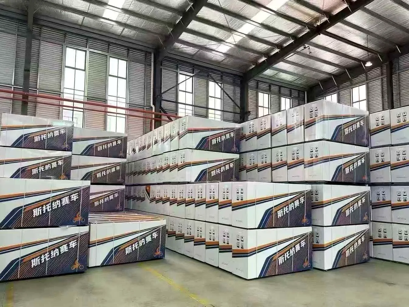 FCDC Motor export cartons stacked inside the warehouse