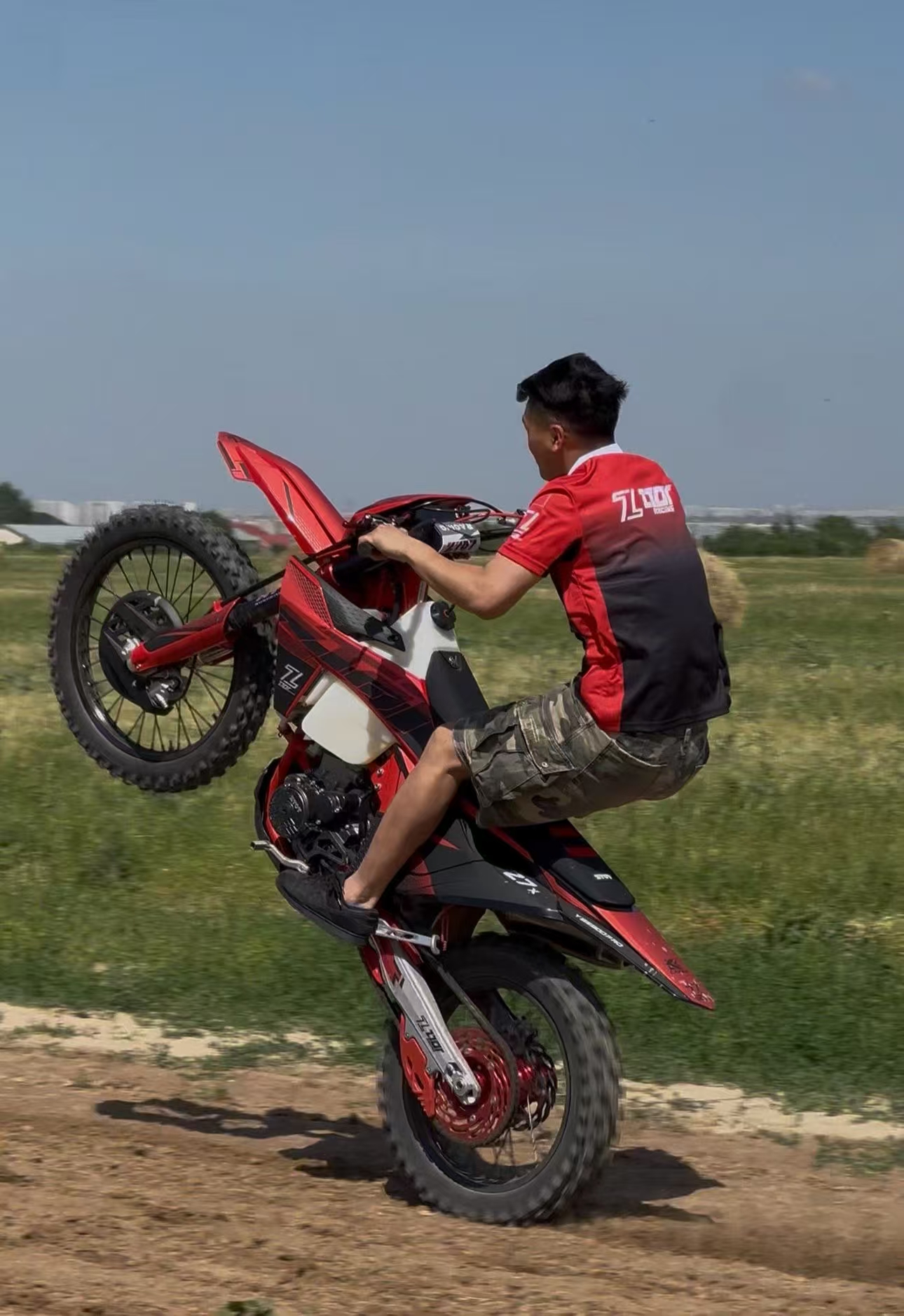 Off-road motorcycle wheelie activity proof